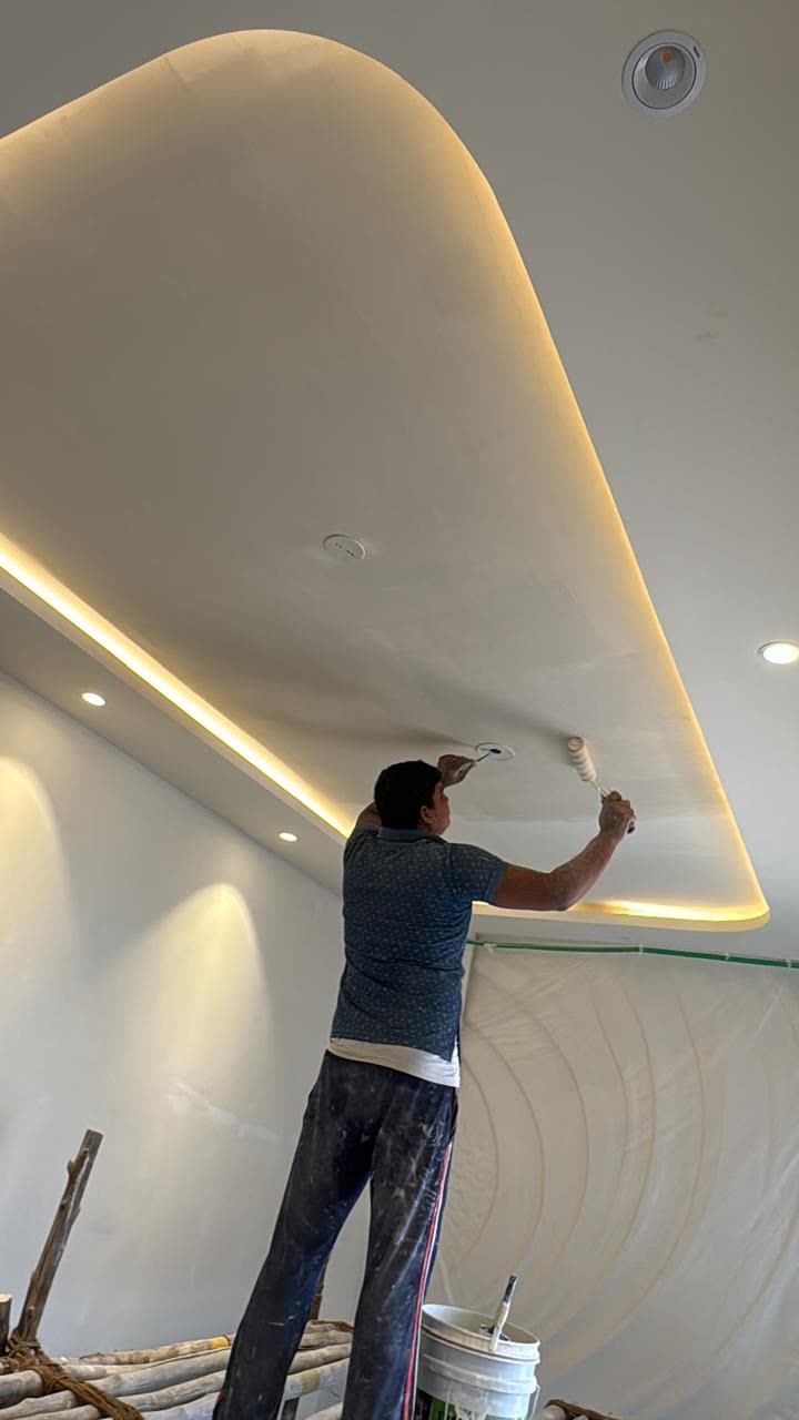 Cove-lit false ceiling being painted at a Core & Canvas site